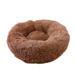 Hundeseng i donutform med blød overflade og polstret kant til rolig hvile for hunde